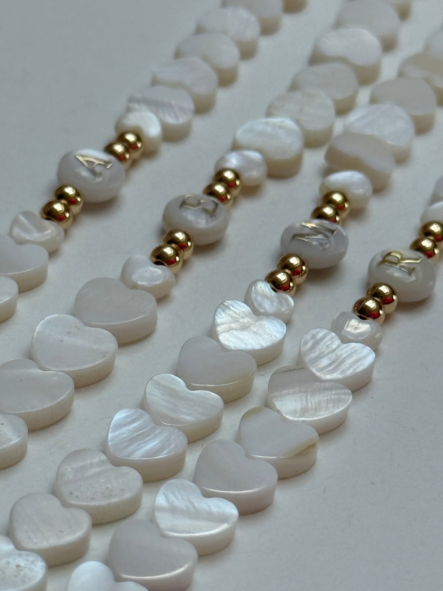 Heart shaped shell beads with shell intial