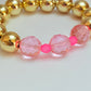 Gold acrylic & pink faceted bead bracelet
