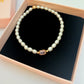Pearl bracelet with 3micron pink centre bead