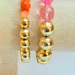 Gold acrylic & pink faceted bead bracelet