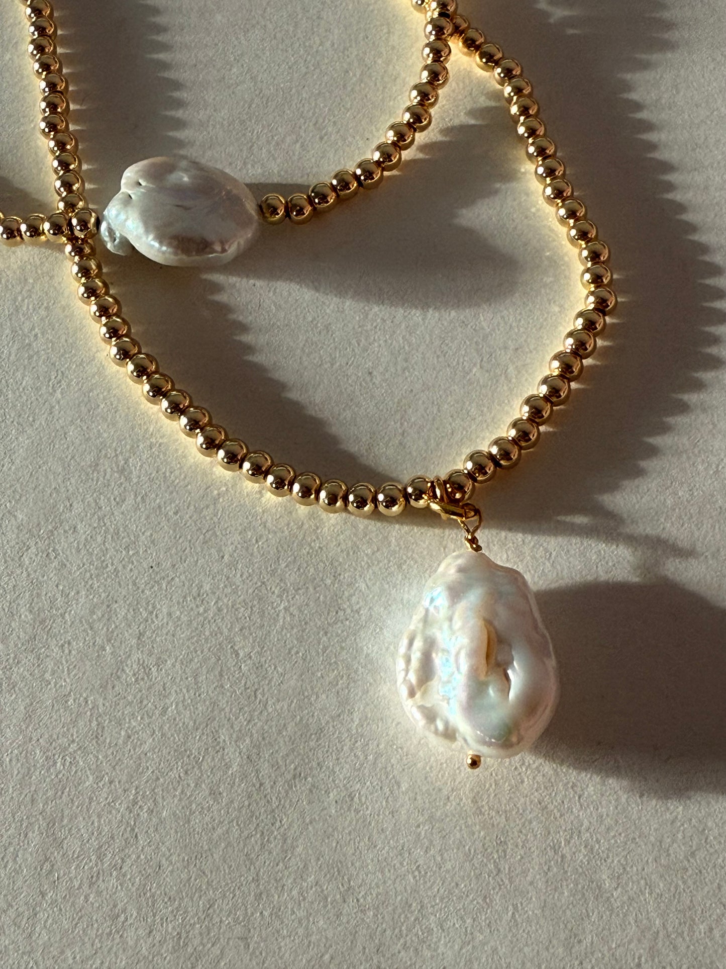 Pearl charm necklace