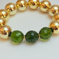 Gold acrylic & green faceted bead bracelet