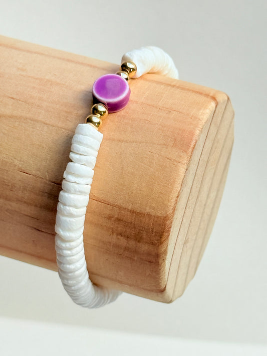 Coral shell with purple clay accent