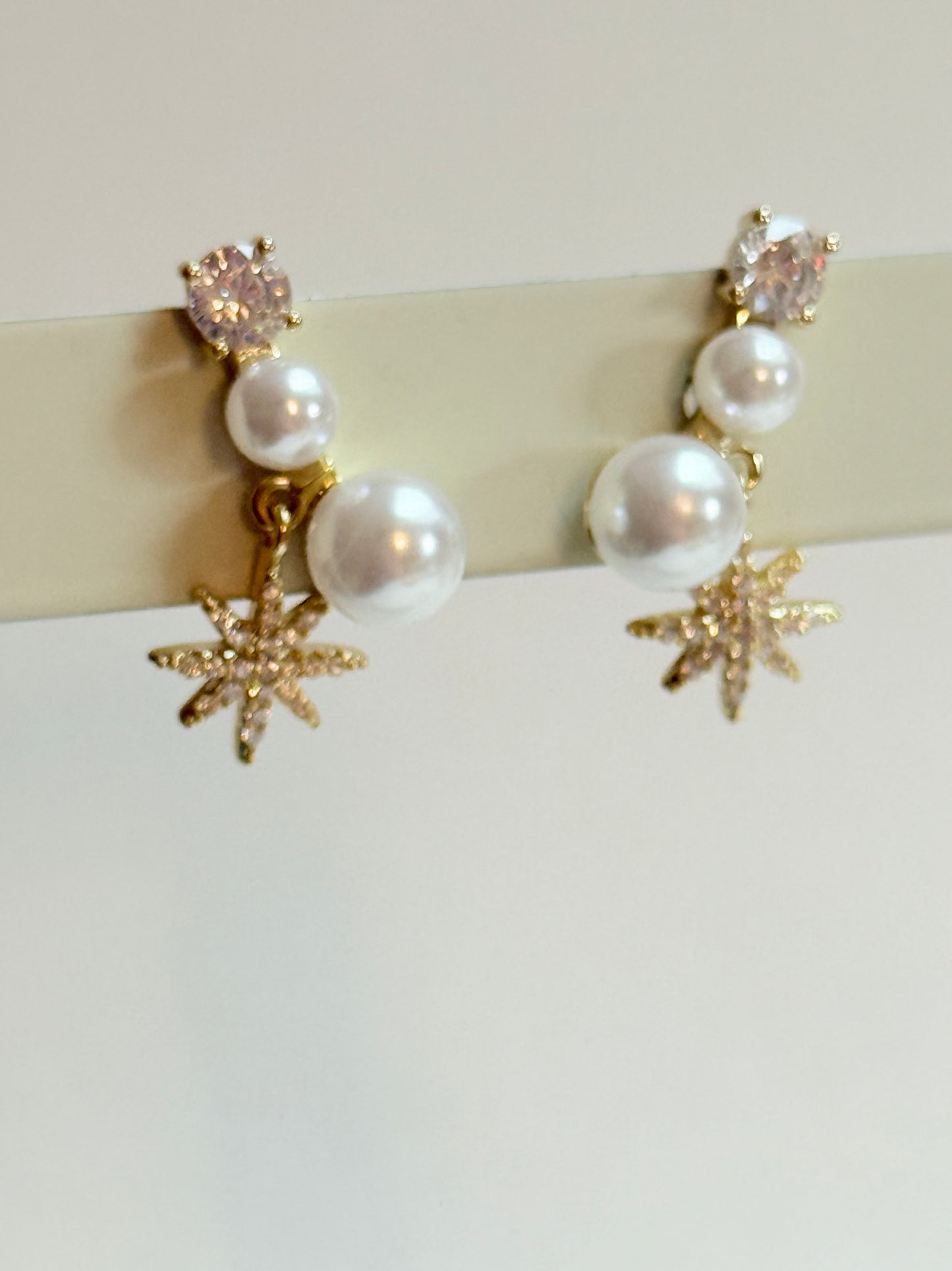 Pearl star earrings