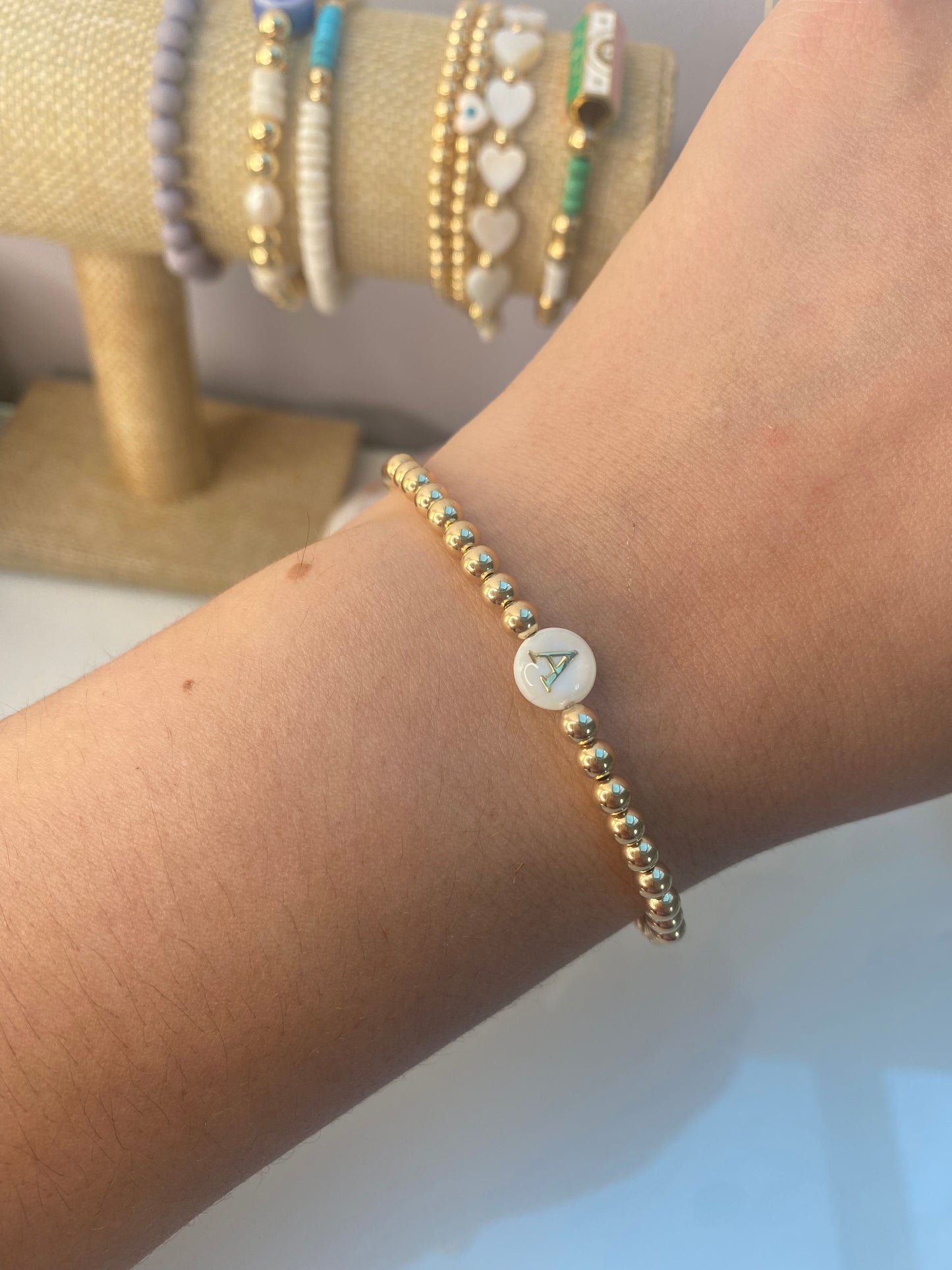 Gold beaded bracelet with Shell Initial